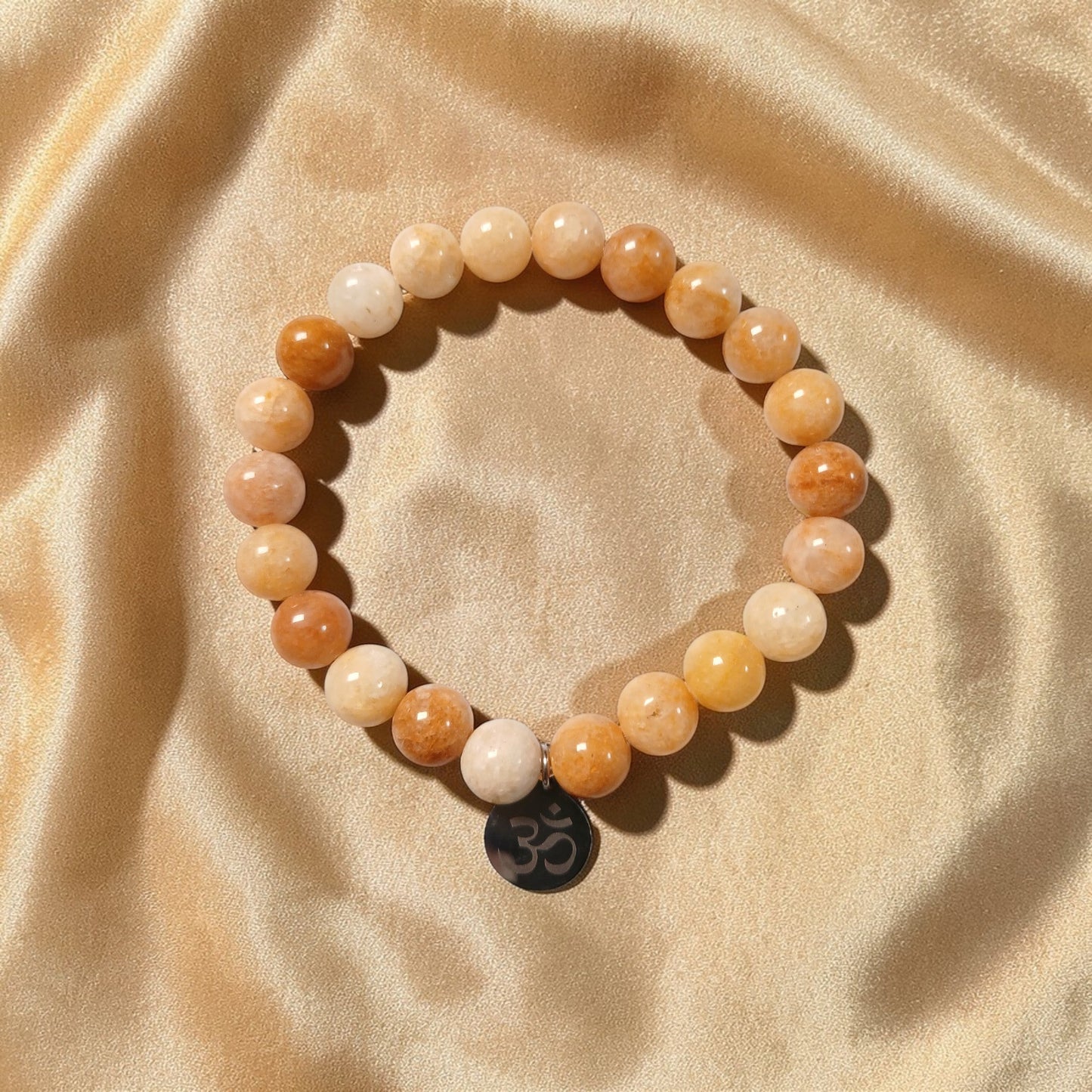 Bracelet "Mantra d'Ozora" Topaze jaune & Om Ozora Création