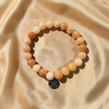 Bracelet "Mantra d'Ozora" Topaze jaune & Om Ozora Création