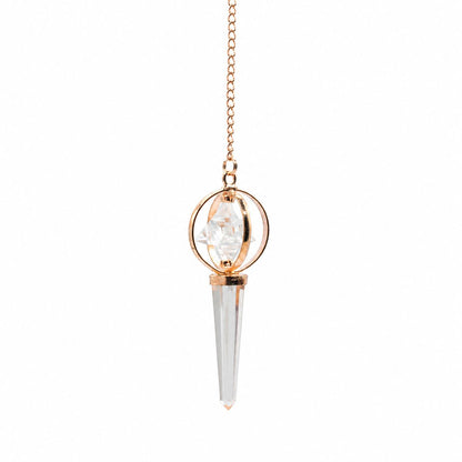 Pendule Merkaba en cristal de roche et cuivre avec étoile tournante. Un pendule divinatoire élégant pour les pratiques énergétiques.