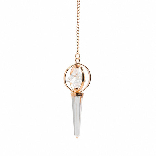 Pendule Merkaba en cristal de roche et cuivre avec étoile tournante. Un pendule divinatoire élégant pour les pratiques énergétiques.